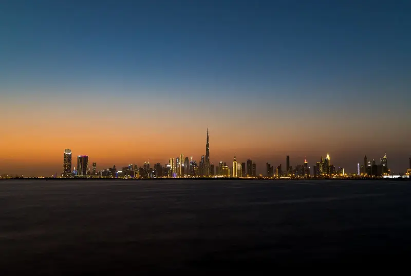 Dubai skyline at twilight with the Burj Khalifa on the horizon